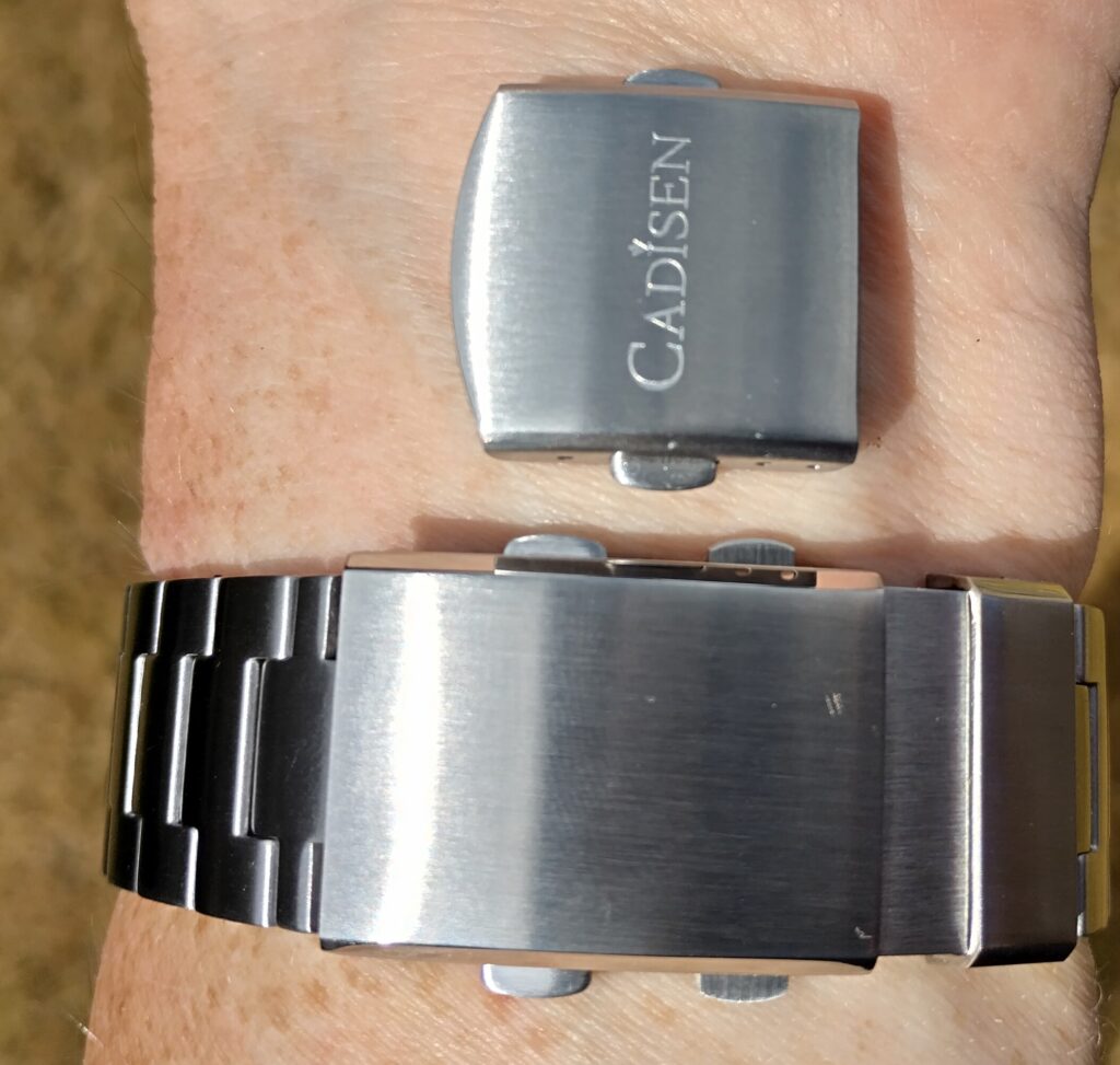 The difference in clasps, the original and the on-the-fly adjustable.